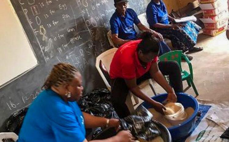 GB2C volunteer's re-bagging rice and beans (Food distribution, Onitsha 2020)